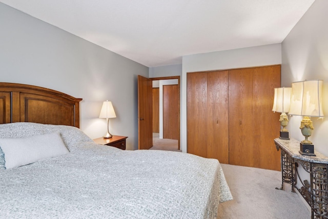 bedroom with light carpet and a closet