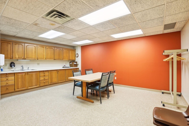 kitchen featuring sink and a drop ceiling