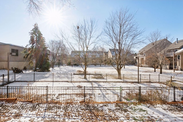 view of yard layered in snow