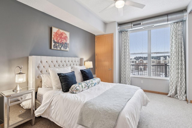 bedroom with visible vents, baseboards, a textured ceiling, a ceiling fan, and carpet