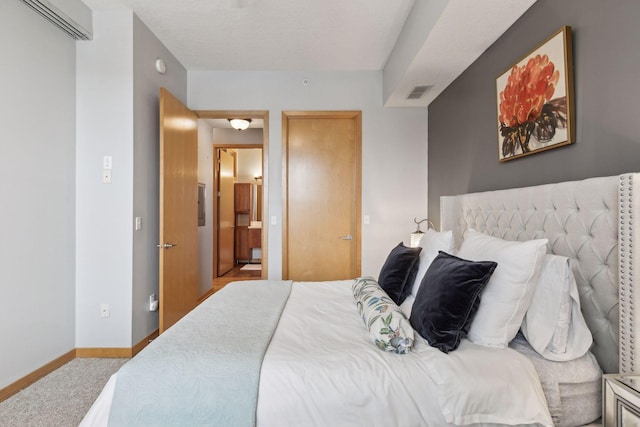 bedroom with light colored carpet, visible vents, and baseboards