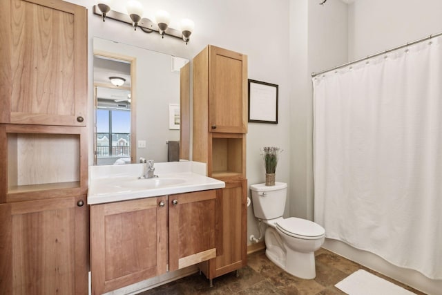 bathroom with vanity, toilet, and a shower with curtain