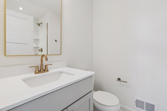 bathroom with visible vents, a shower, toilet, vanity, and recessed lighting