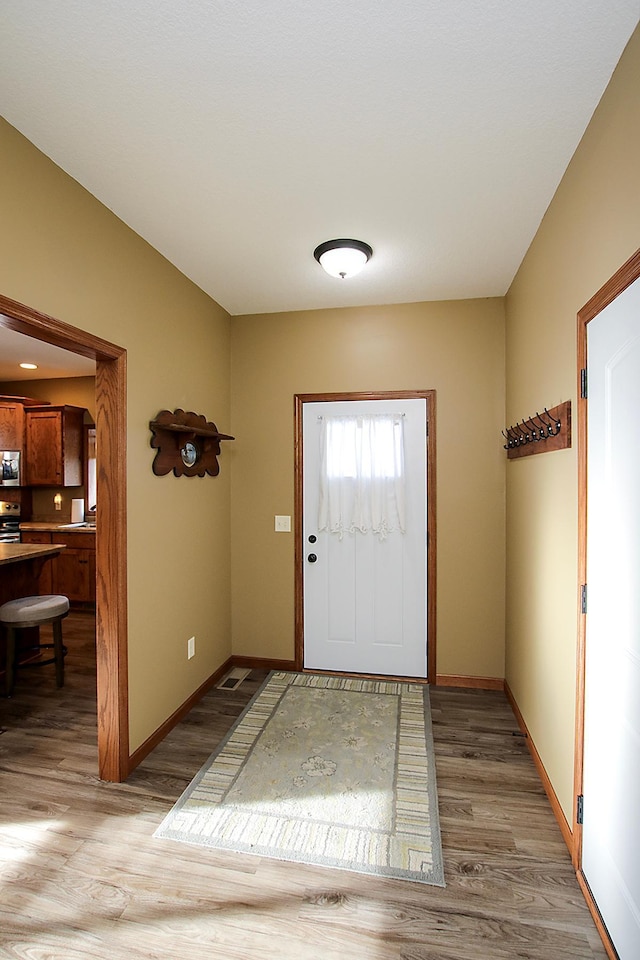 foyer with light hardwood / wood-style flooring