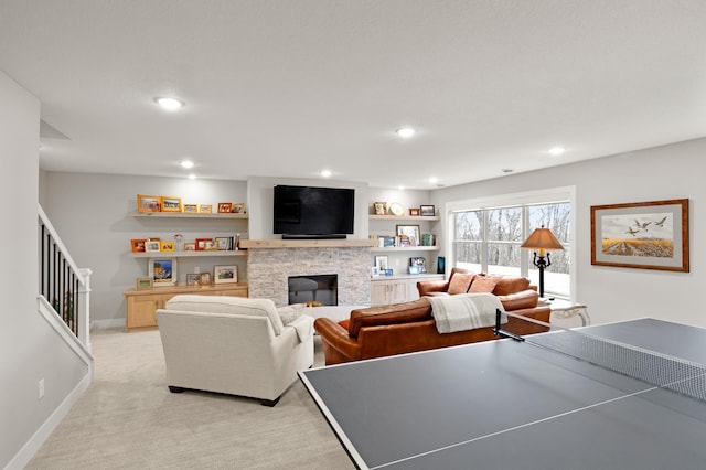 carpeted living room with a fireplace