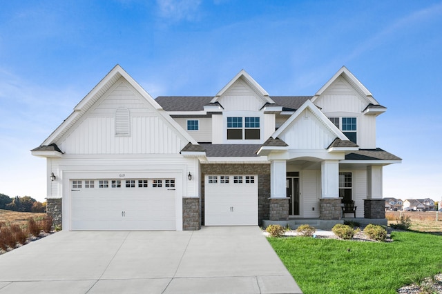 craftsman-style home with a front lawn