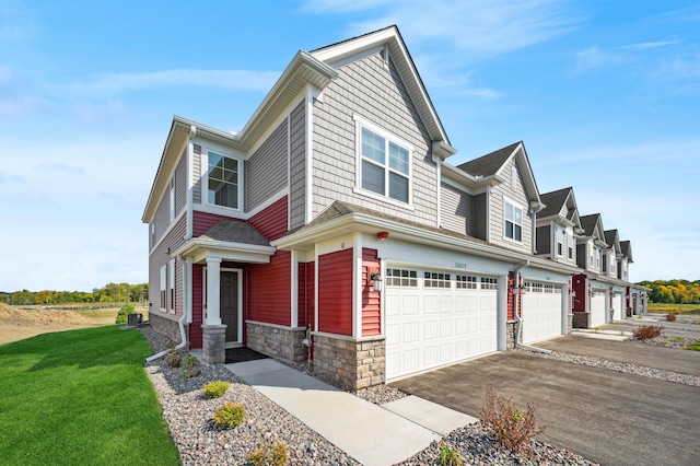 view of front of property with a garage and a front lawn