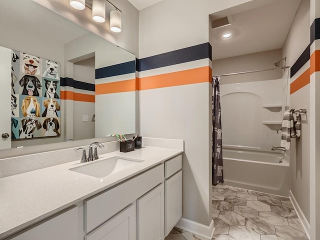 bathroom featuring vanity and shower / tub combo