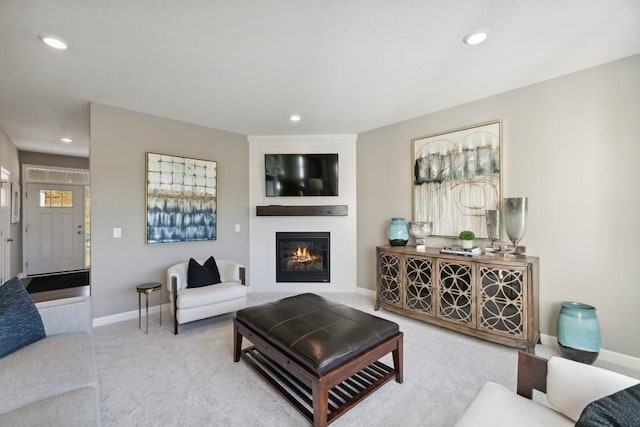 living room featuring a fireplace and light colored carpet