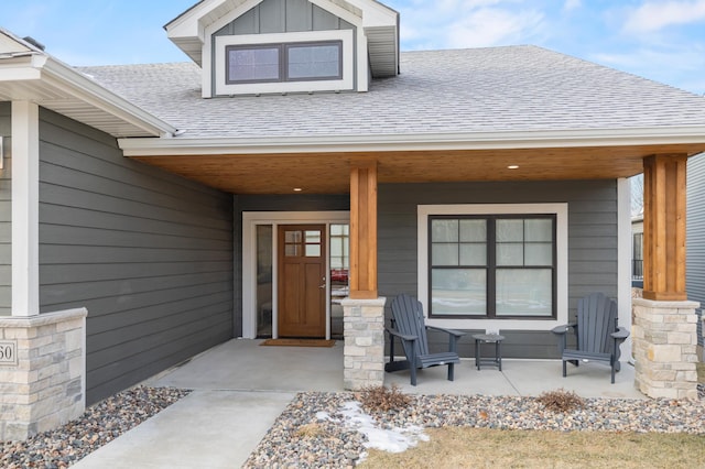 view of exterior entry featuring a porch