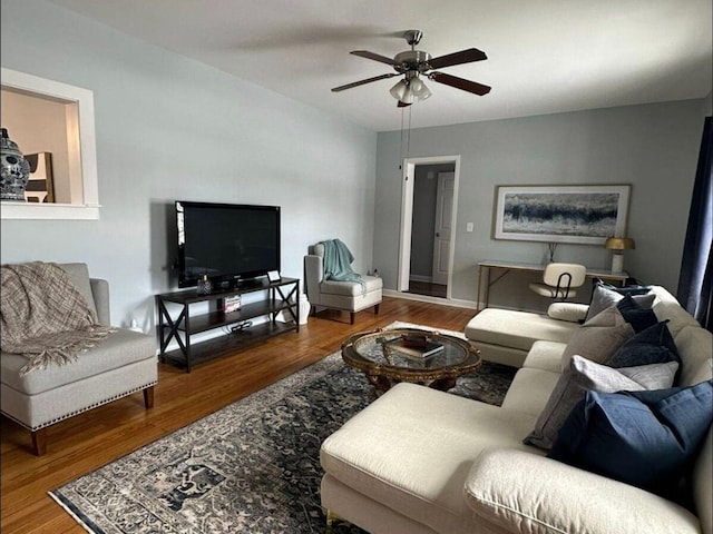 living room featuring ceiling fan and wood-type flooring