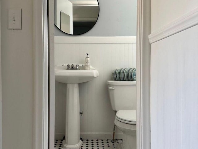 bathroom with tile patterned floors and toilet