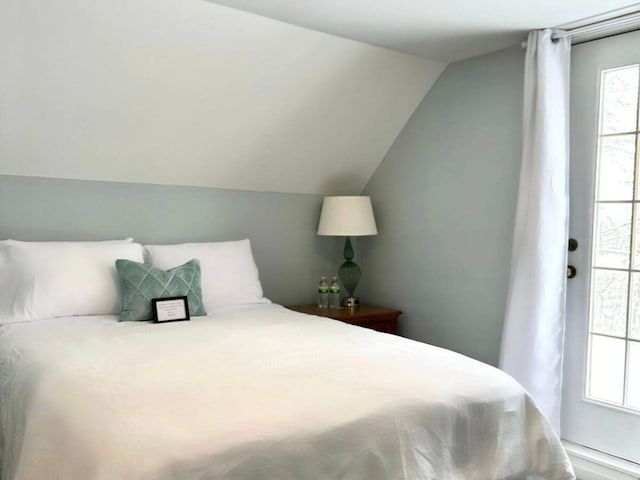 bedroom with vaulted ceiling