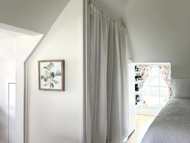 bedroom with lofted ceiling