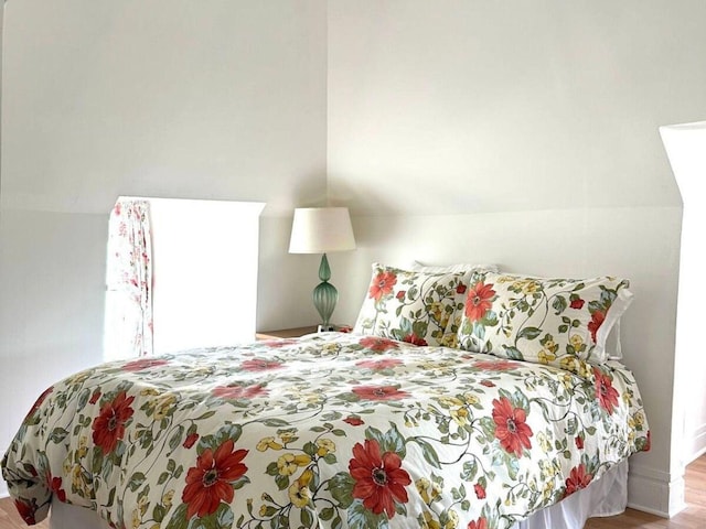 bedroom with light wood-type flooring