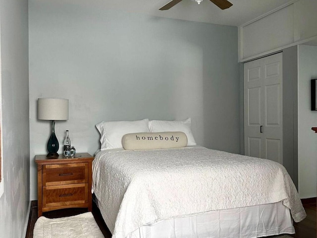 bedroom featuring wood-type flooring, a closet, and ceiling fan