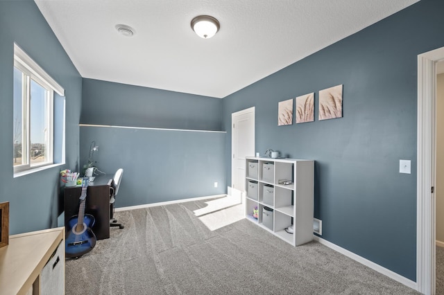 home office featuring carpet floors, visible vents, and baseboards