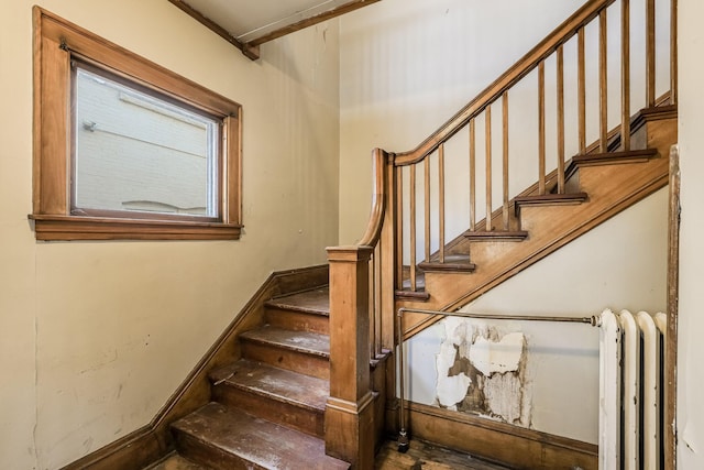 staircase featuring radiator heating unit