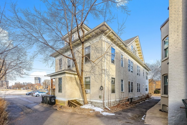 view of side of property featuring cooling unit