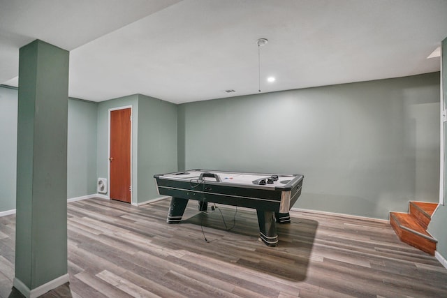 game room with wood-type flooring