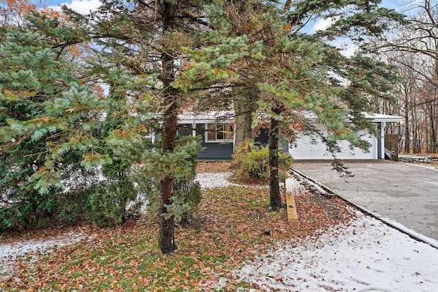 obstructed view of property featuring a garage