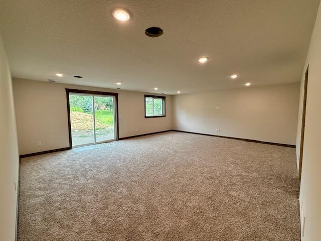 8001 Petunia St, Victoria, MN 55386 - carpeted empty room featuring recessed lighting