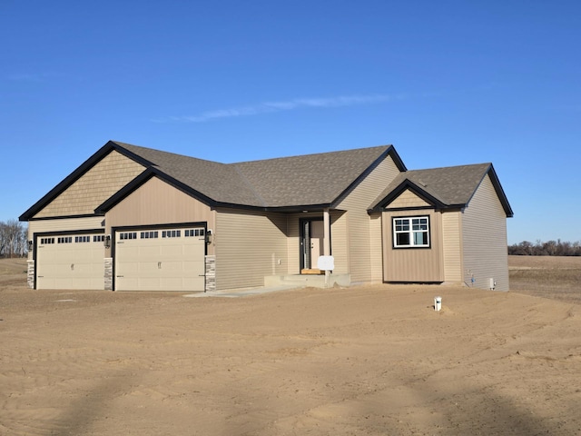 view of front of property with a garage