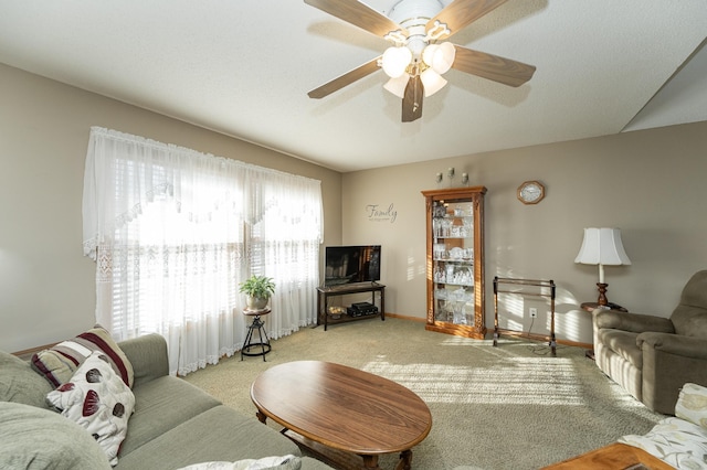 living room with light carpet and ceiling fan