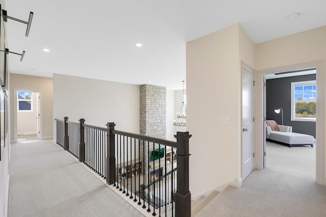 hallway featuring light carpet