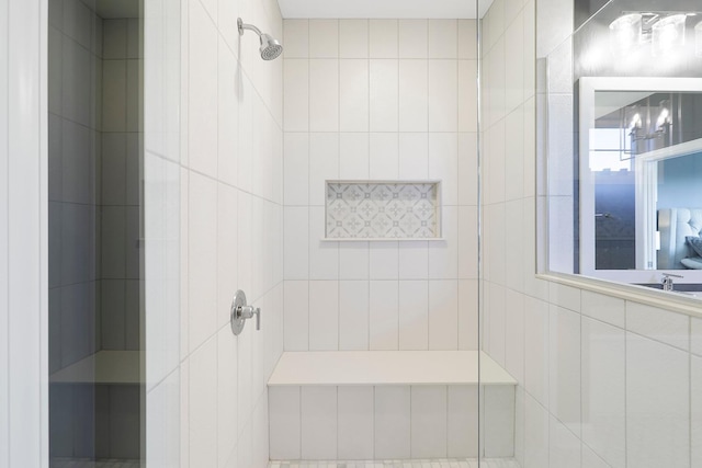 bathroom with a tile shower