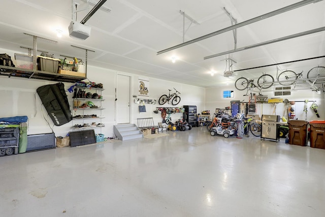 garage featuring a garage door opener