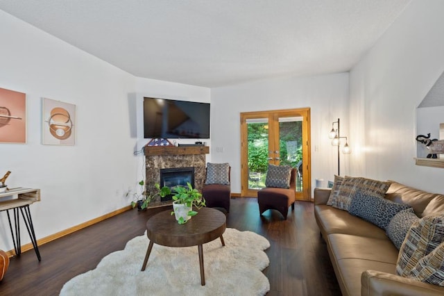 living room with dark hardwood / wood-style flooring and a high end fireplace