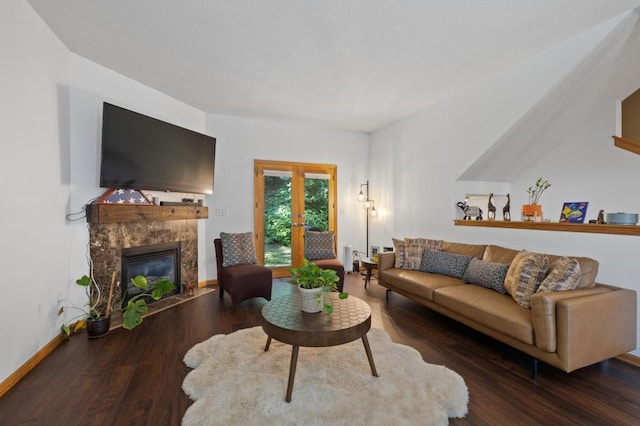 living room with hardwood / wood-style floors and a premium fireplace