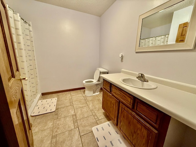 bathroom featuring vanity, toilet, a textured ceiling, and walk in shower