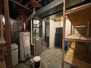 utility room with gas water heater