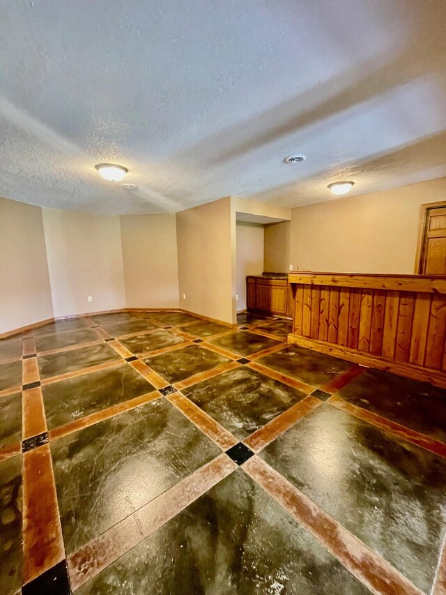 empty room featuring a textured ceiling