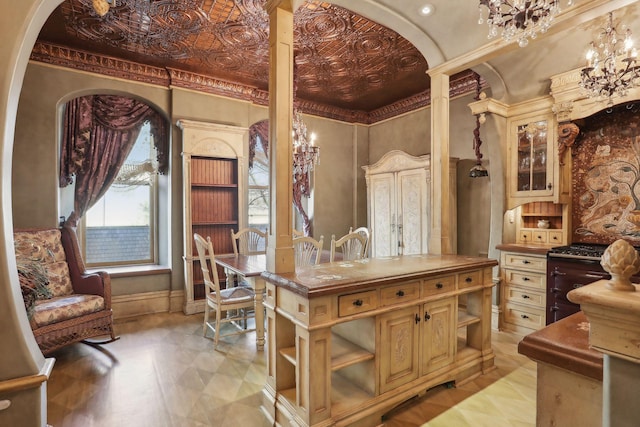 interior space with crown molding and a notable chandelier