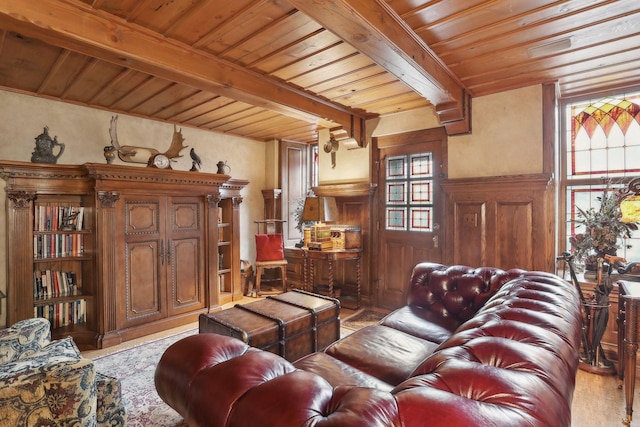 living room with beam ceiling and wooden ceiling