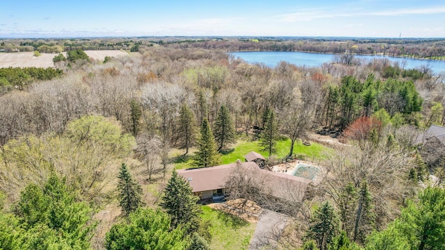 bird's eye view with a water view and a view of trees
