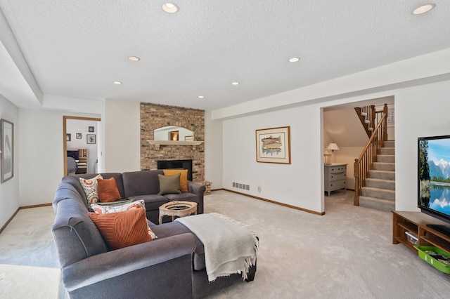living room with visible vents, recessed lighting, stairs, and light carpet