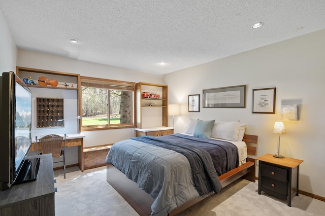 bedroom with baseboards, light carpet, recessed lighting, and a textured ceiling