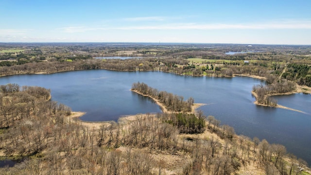 aerial view featuring a water view and a view of trees