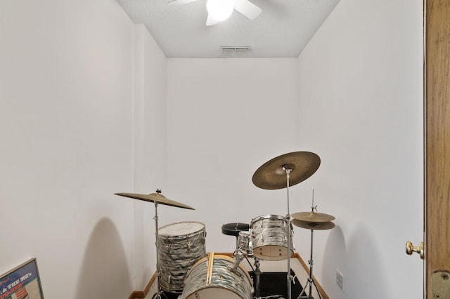 interior details featuring a ceiling fan, baseboards, and visible vents