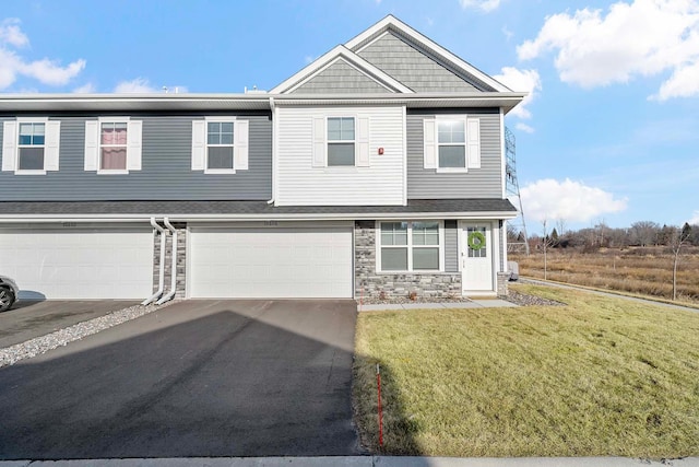 view of front of home featuring a garage and a front yard