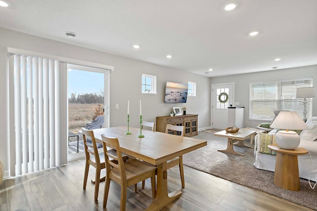 dining space with light wood-type flooring