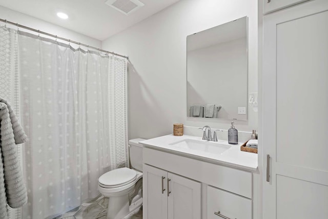 full bathroom featuring shower / bath combo with shower curtain, tile patterned floors, toilet, and vanity