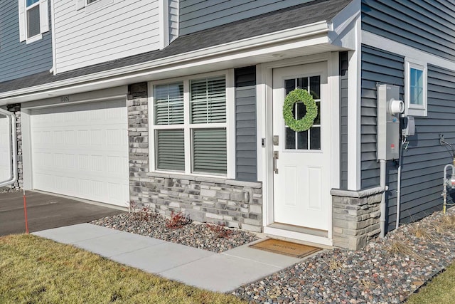 view of exterior entry featuring a garage