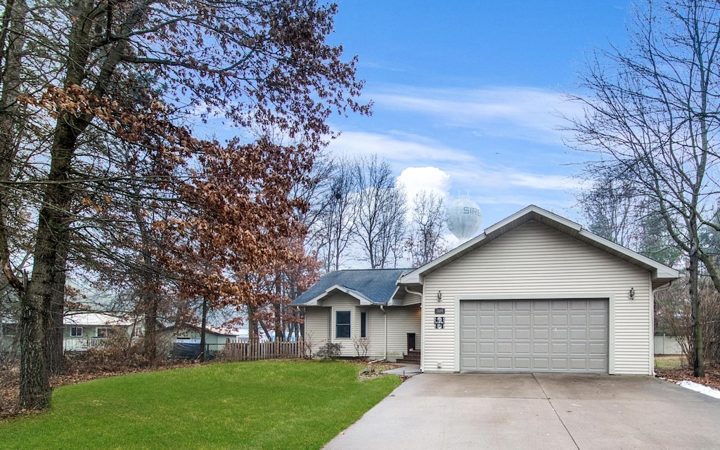 single story home with a front yard and a garage