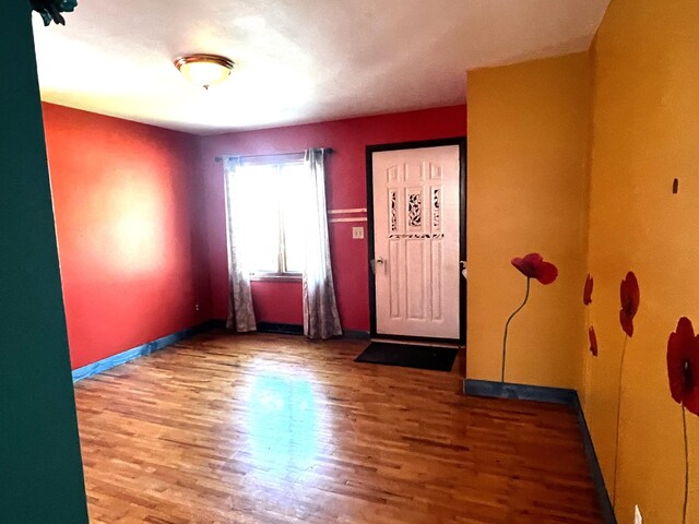 entryway with hardwood / wood-style flooring