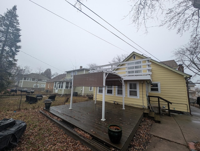 back of house featuring a balcony